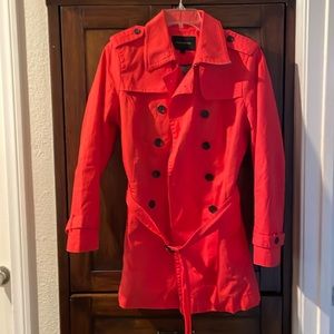 Coral trench coat in a size Large from Banana Republic.Lining blue and white.